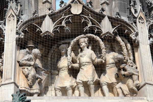 Sculpture of procession on Neues Rathaus. Munich, Germany.