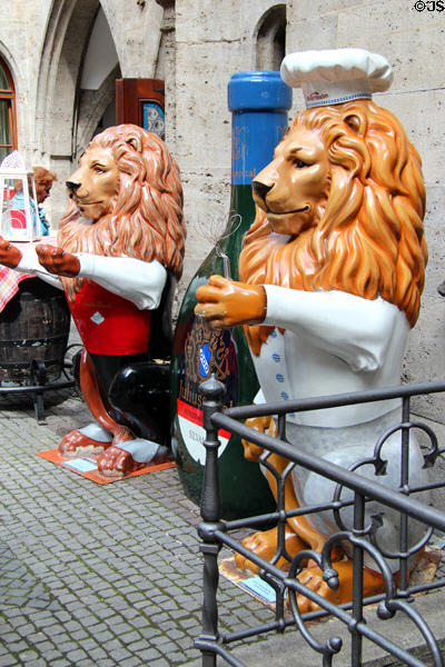 Lion statues promoting restaurant at Neues Rathaus. Munich, Germany.