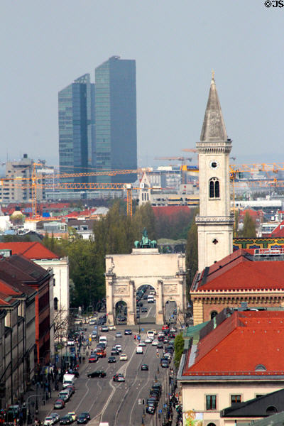 Victory gate (1852) by Eduard Mezger & St Ludwig church spire (1844) by Friedrich von Gärtner with highrises beyond north of city. Munich, Germany.