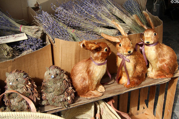 Hedgehog & rabbits sculpted from plant matter in shop at Viktualienmarkt. Munich, Germany.