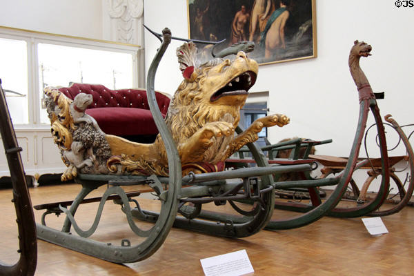 Carved horse-drawn snow sledge with lion theme (c1680) from Bavaria at German Hunting & Fishing Museum. Munich, Germany.