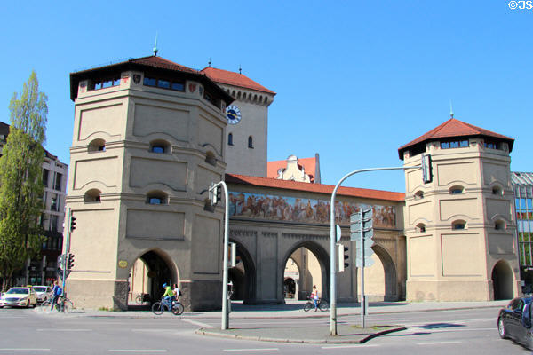 Octagonal towers plus taller clock tower of Isartor city gate. Munich, Germany.