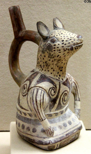 Moche culture ceramic stirrup vessel in shape of fox-like creature with human body (100 BCE- 600 CE) from north coast of Peru at Five Continents Museum. Munich, Germany.
