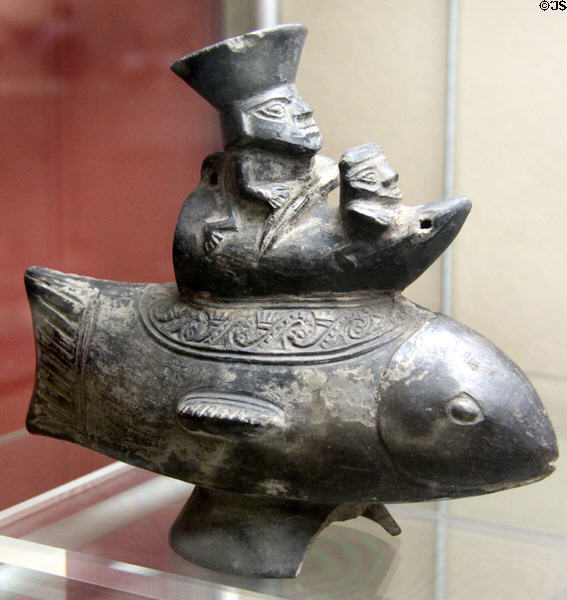 Chimu culture ceramic man with monkey on balsa boat on top of fish (1100-1450 CE) from northern coast of Peru at Five Continents Museum. Munich, Germany.