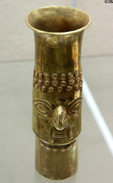 Inca culture gold beaker with face relief (1450-1532 CE) from southern coast of Peru at Five Continents Museum. Munich, Germany.