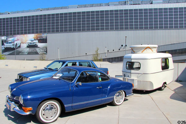Car with caravan trailer outside BMW Museum. Munich, Germany.