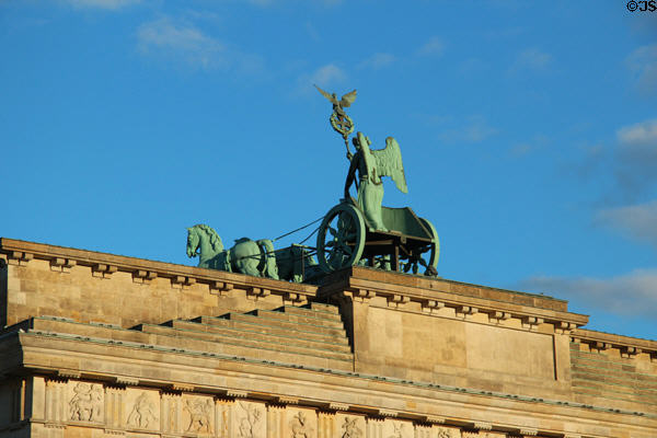 Winged victory riding quadriga chariot (1793) by Johann Gottfried Schadow atop Brandenburg Gate. Berlin, Germany.