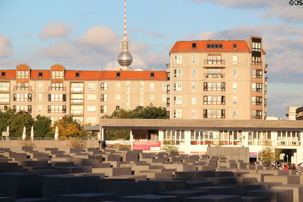 Monument to Murdered Jews of Europe with low-rise display center just behind blocks. Berlin, Germany.