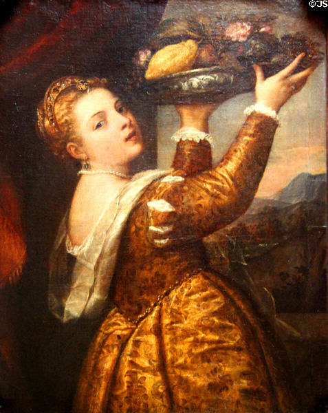 Young woman with plate of fruit painting (1555) by Titian at Berlin Gemaldegalerie. Berlin, Germany.