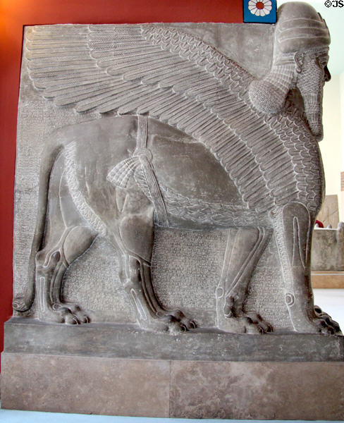 Assyrian schedu lamassu, a human headed, winged lion with horned crown cast from British Museum at Pergamon Museum. Berlin, Germany.
