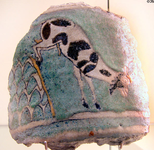 Fragment of ceramic vessel painted with jumping mountain goat (8th-7thC BCE) from Turkey at Pergamon Museum. Berlin, Germany.
