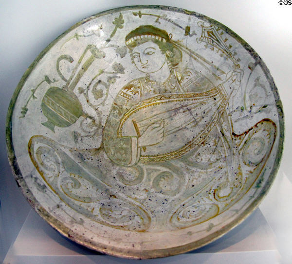 Earthenware dish painted with lute player (11th-12thC) from Cairo, Egypt at Pergamon Museum. Berlin, Germany.