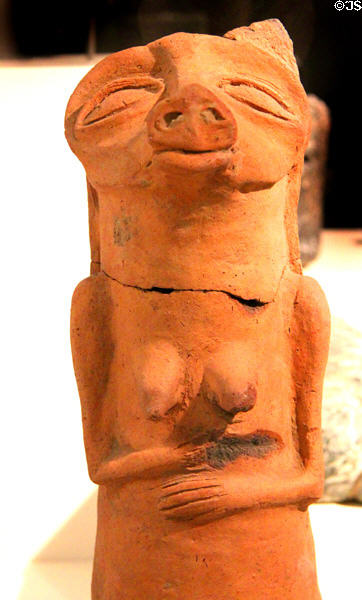 Egyptian early times ceramic statue of woman with pig's head (3050-2850 BCE) at Neues Museum. Berlin, Germany.