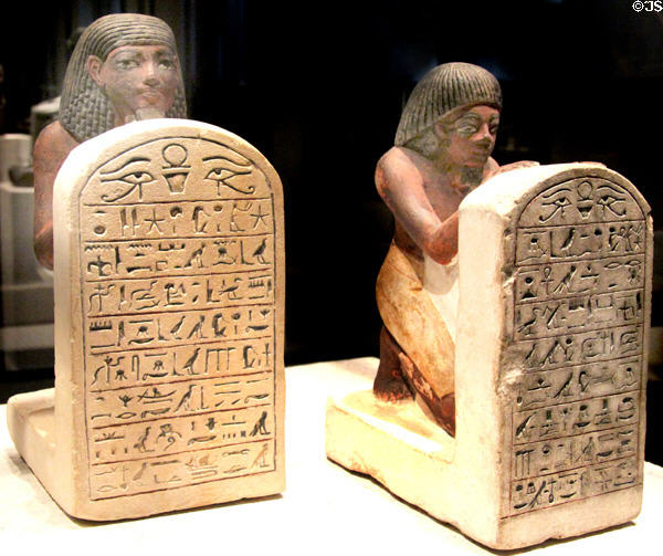 Egyptian stone statues of Sa-Iset & Samut holding stelae with prayers to the sungod (c1500-1400 BCE) (New Kingdom, 18th Dynasty) from Thebes West at Neues Museum. Berlin, Germany.