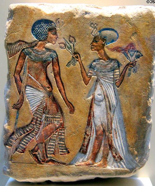 Egyptian painted stone relief of royal couple in garden (c1335 BCE) (New Kingdom, 18th Dynasty) from Amarna at Neues Museum. Berlin, Germany.