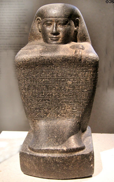 Egyptian stone block statue of chief steward Harua with Hieroglyphics (c500 BCE) (Late Period, 26th Dynasty) from Thebes at Neues Museum. Berlin, Germany.