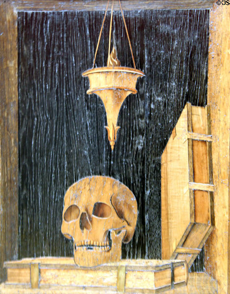 Detail of skull on inlaid wooden choir stalls (c1500) from Pavia at Bode Museum. Berlin, Germany.