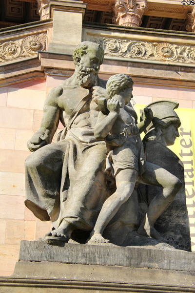 Sculpture of sculptor hammering sculptures outside Alte Nationalgalerie. Berlin, Germany.