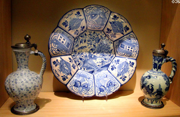 Ceramic ridged plate & covered jugs painted in Delft style (early 18thC) made in Germany by Dutch artists fleeing religious persecution in Netherlands at German Historical Museum. Berlin, Germany.