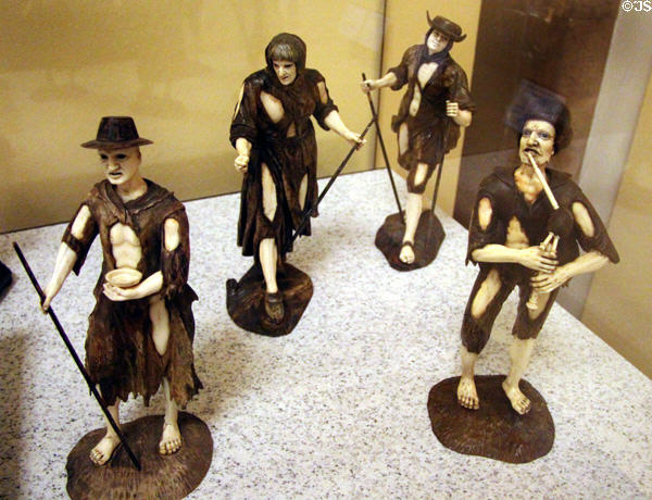 Group of carved wood & ivory figurines of beggars (c1750) from southern Germany at German Historical Museum. Berlin, Germany.