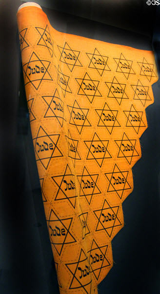 Fabric roll with printed yellow Jewish Stars (1941-5) which Jews were required to purchase & sew to clothing in order to appear in public at Jewish Museum Berlin. Berlin, Germany.