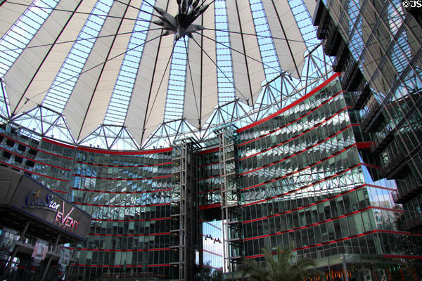 Office building with red stripes faces glass-roofed forum of Sony Center. Berlin, Germany.