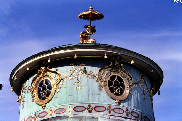 Chinese House cupola topped with gilded Chinese figure with open parasol by Friedrich Jury & oval light-admitting windows at Sanssouci Park. Potsdam, Germany.