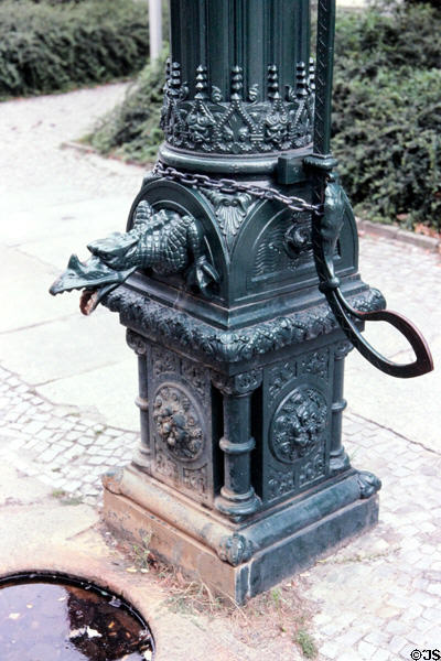 Dragon water pump fountain in Nikolai verteil district. Berlin, Germany.