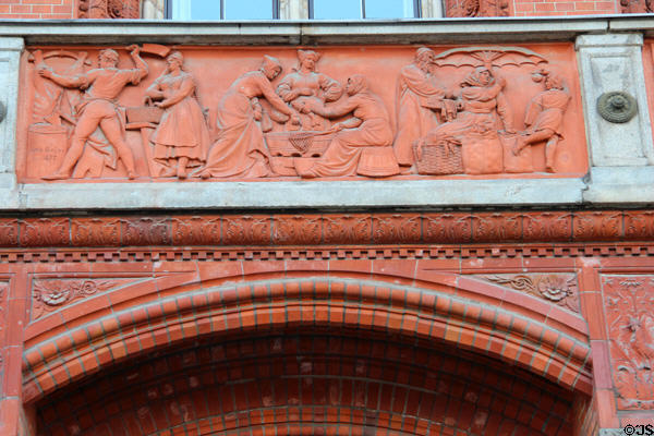 Food market frieze (1877) by Otto Geyer on balcony of Rotes Rathaus. Berlin, Germany.