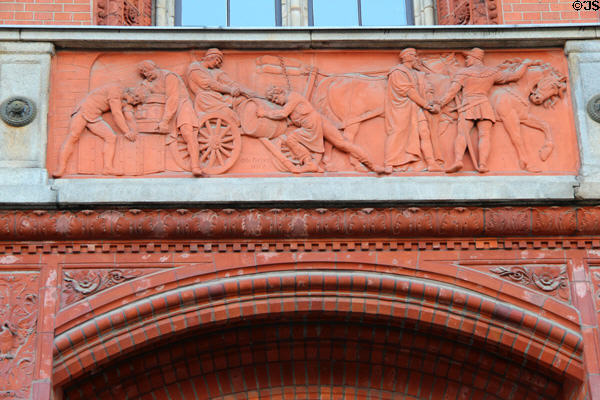 Horse-drawn freight wagon scene frieze (1877) by Otto Geyer on balcony of Rotes Rathaus. Berlin, Germany.