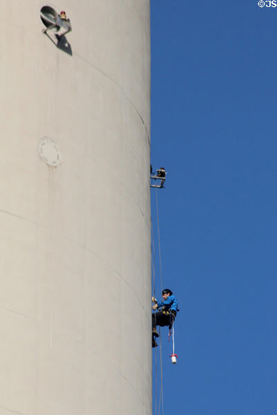 Worker cleaning Berlin Television Tower. Berlin, Germany.