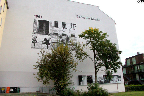 Mural with photo of fleeing Berliners on building at Bernauer Straße Berlin Wall Memorial. Berlin, Germany.