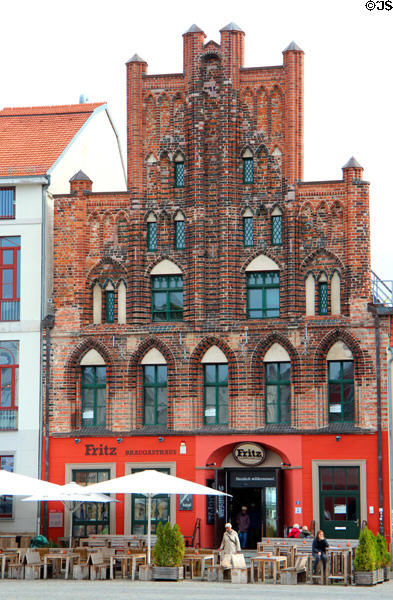 Stepped brick Gothic commercial building on Market square. Greifswald, Germany.