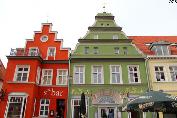 Multicolored shops off Market square. Greifswald, Germany.