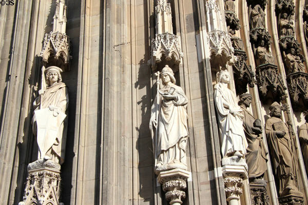 Carved figures beside south entrance doors to Köln Cathedral. Köln, Germany.