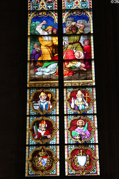 Stained glass windows depicting a stoning scene & various saints in Köln Cathedral. Köln, Germany.