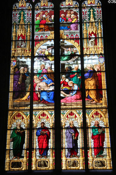 Stained glass windows depicting the Last Supper, Crucifixion & Evangelists with their symbols at Köln Cathedral. Köln, Germany.
