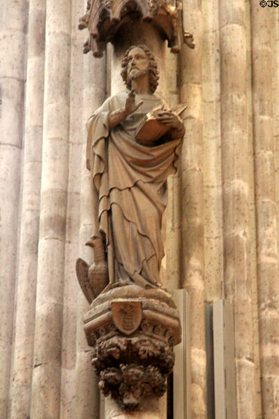Statue of Evangelist St John with his eagle symbol at Köln Cathedral. Köln, Germany.