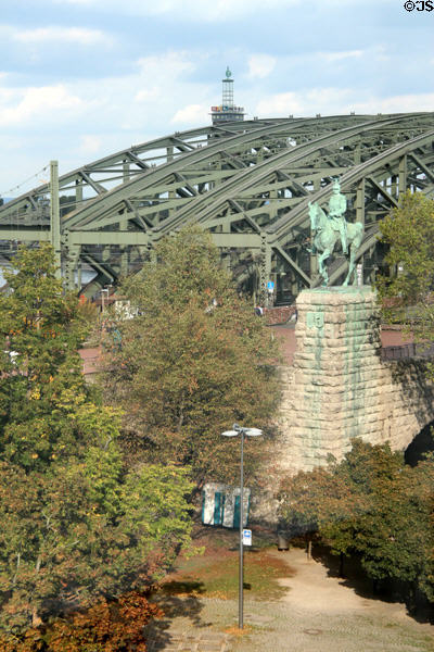 Hohenzollern Bridge with statue of Wilhelm II in the foreground. Köln, Germany.