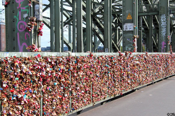 Love locks by the thousands attached to fence on Hohenzollern Bridge. Köln, Germany.