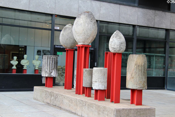 Roman era columnar stones mounted on beams as a sculpture outside Roman Germanic Museum. Köln, Germany.