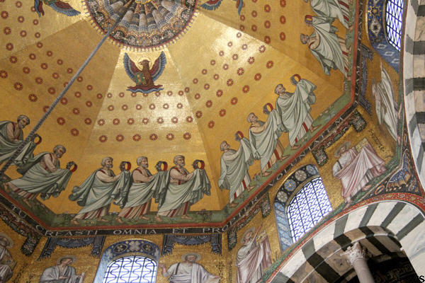 Eagle representing Evangelist St John & Elders from Apocalypse of St John offering their crowns to Christ above gallery in Palatine Chapel at Aachen Cathedral. Aachen, Germany.