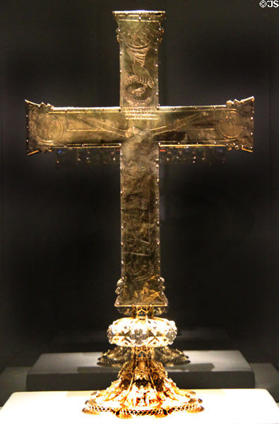 Gold, gilded silver back of Cross of Lothair (last quarter 10thC) with engraved crucifixion & gilded silver pedestal (3rd quarter 14thC) at Aachen Cathedral Treasury. Aachen, Germany.