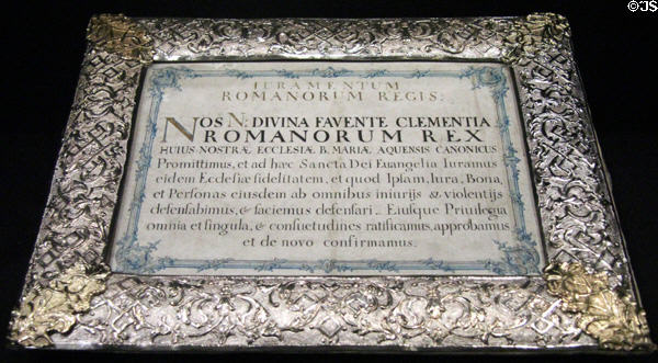 Oath of the German King as a Canon of Marian Collegiate Church in silver frame (c1740) at Aachen Cathedral Treasury. Aachen, Germany.
