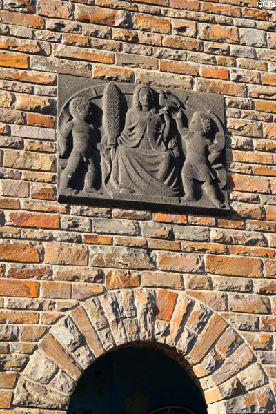Crest with woman & two children on brick wall. Cochem, Germany.