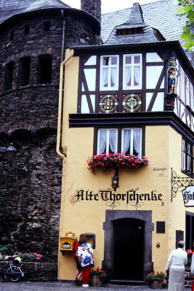 Historic half-timbered building with flood high water line above door. Cochem, Germany.