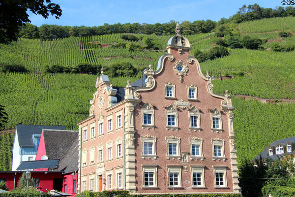 Mönchhof building with Dutch style facade set against vineyard. Ürzig, Germany.
