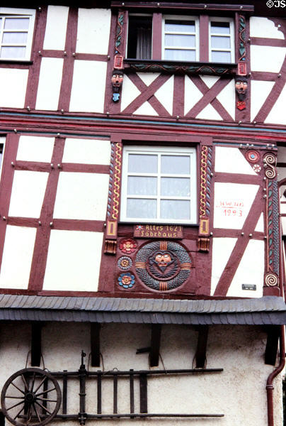 Altes Fahrhaus (Old Ferryhouse) (1621) three story, half-timbered house adorned with carvings on facade. Pünderich, Germany.