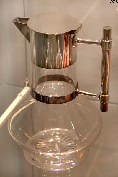 Lidded jug of silver & glass (1885) by Christopher Dresser (London) at Hamburg Decorative Arts Museum. Hamburg, Germany.