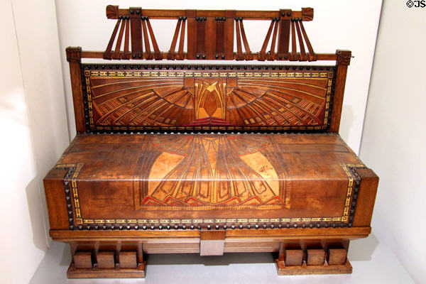 Bench in stained oak & leather (1902) by Peter Behrens made by George Hulbe of Hamburg for Arts & Crafts Exhibition of Turin (1902) at Hamburg Decorative Arts Museum. Hamburg, Germany.